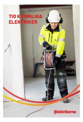 En kvinnlig elektriker på sin arbetsplats som håller i en rulle med kabel